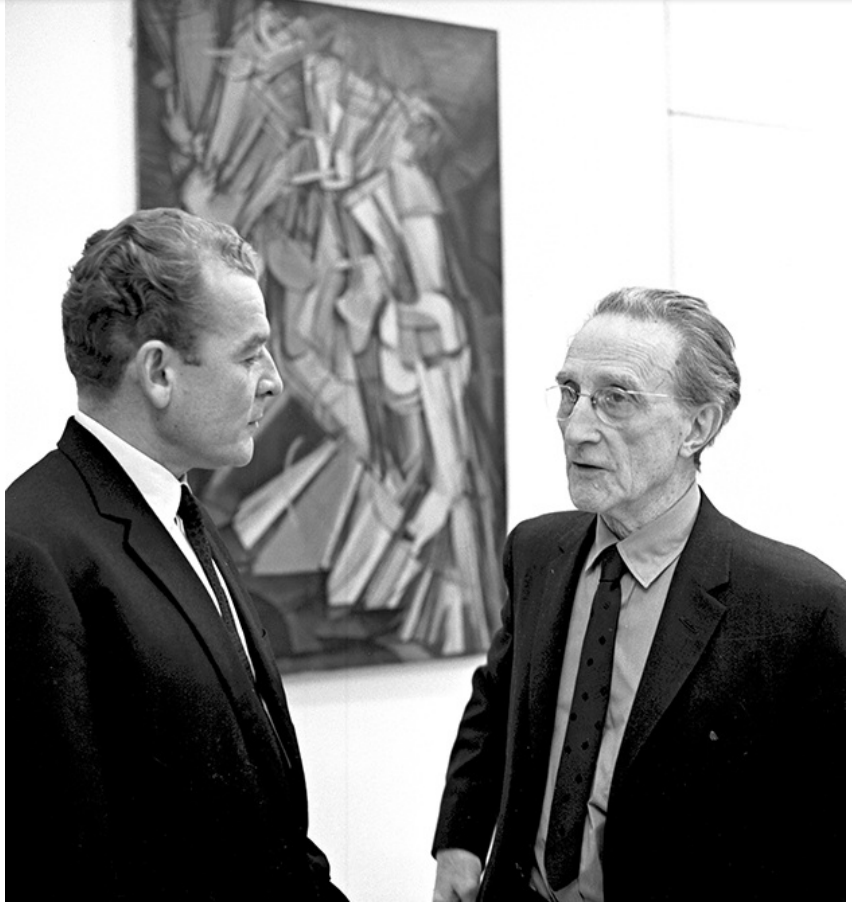 FIGURE 1.3 Marcel Duchamp discussing his abstract painting Nude Descending a Staircase